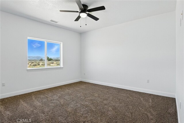 15323 Turquoise Rd, Apple Valley, CA 92307 - empty room with dark colored carpet and ceiling fan
