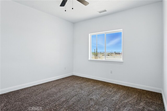 15323 Turquoise Rd, Apple Valley, CA 92307 - unfurnished room featuring dark colored carpet and a ceiling fan