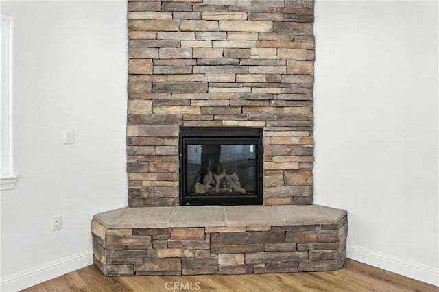 15323 Turquoise Rd, Apple Valley, CA 92307 - detailed view of wood finished floors and a stone fireplace