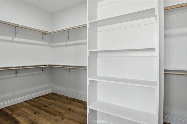 15323 Turquoise Rd, Apple Valley, CA 92307 - walk in closet featuring dark wood-style floors