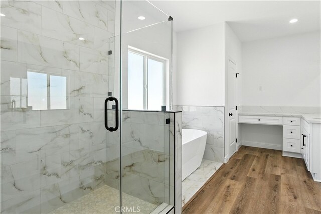 15323 Turquoise Rd, Apple Valley, CA 92307 - bathroom with a freestanding bath, healthy amount of natural light, a marble finish shower, recessed lighting, and vanity