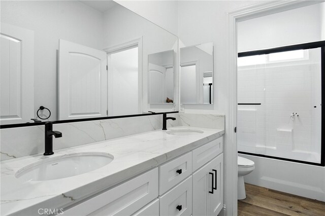 15323 Turquoise Rd, Apple Valley, CA 92307 - full bathroom with double vanity,  shower combination, and wood finished floors