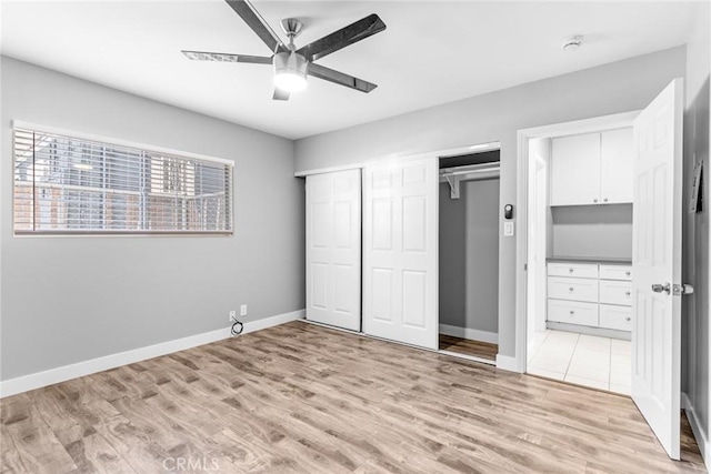 1106 Pacific Ave, Long Beach, CA 90813 - unfurnished bedroom with light wood-type flooring, multiple closets, ensuite bathroom, and a ceiling fan