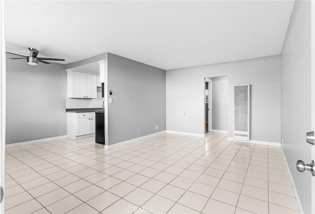 1106 Pacific Ave, Long Beach, CA 90813 - spare room featuring a heating unit, a ceiling fan, and light tile patterned floors