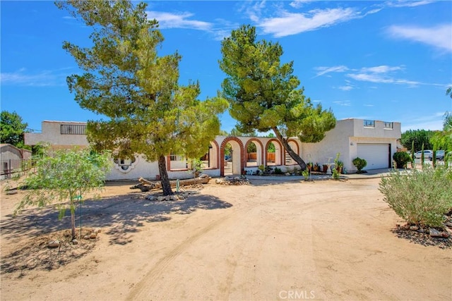 7165 Lyons Ave, Hesperia, CA 92345 - view of front of home with stucco siding and driveway
