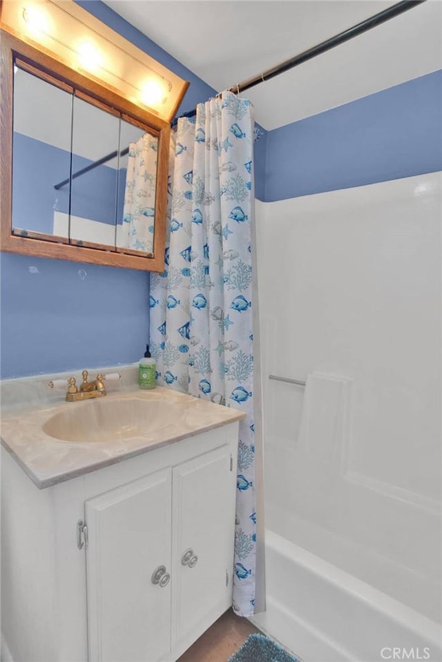 7165 Lyons Ave, Hesperia, CA 92345 - bathroom featuring shower / tub combo and vanity