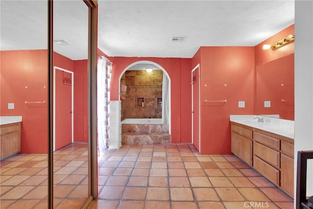 7165 Lyons Ave, Hesperia, CA 92345 - bathroom featuring vanity, a garden tub, and tile patterned flooring