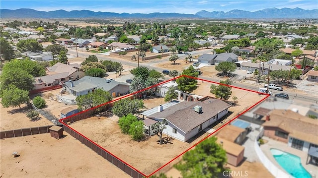 7165 Lyons Ave, Hesperia, CA 92345 - aerial view of residential area with a mountain backdrop and property parcel outlined