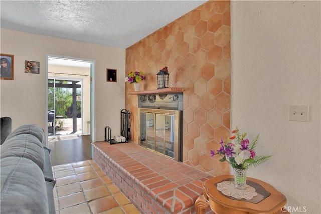 7165 Lyons Ave, Hesperia, CA 92345 - tiled living room with a textured ceiling and a glass covered fireplace