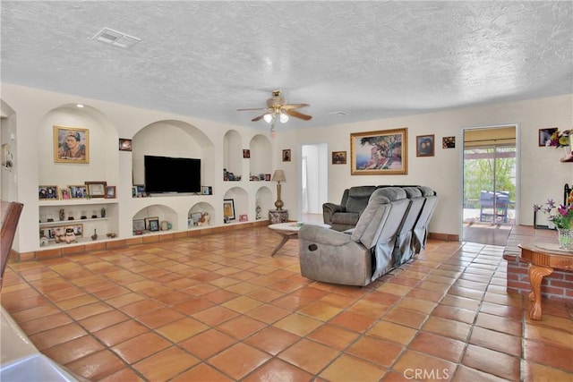 7165 Lyons Ave, Hesperia, CA 92345 - tiled living area featuring built in features, ceiling fan, and a textured ceiling