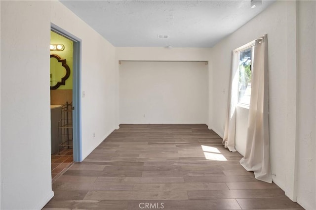 7165 Lyons Ave, Hesperia, CA 92345 - empty room with wood finished floors