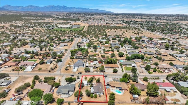 7165 Lyons Ave, Hesperia, CA 92345 - aerial overview of property's location with property parcel outlined and a mountain backdrop