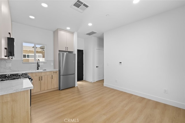 542 N Keystone St, Burbank, CA 91506 - kitchen with freestanding refrigerator, light wood finished floors, recessed lighting, light brown cabinetry, and decorative backsplash
