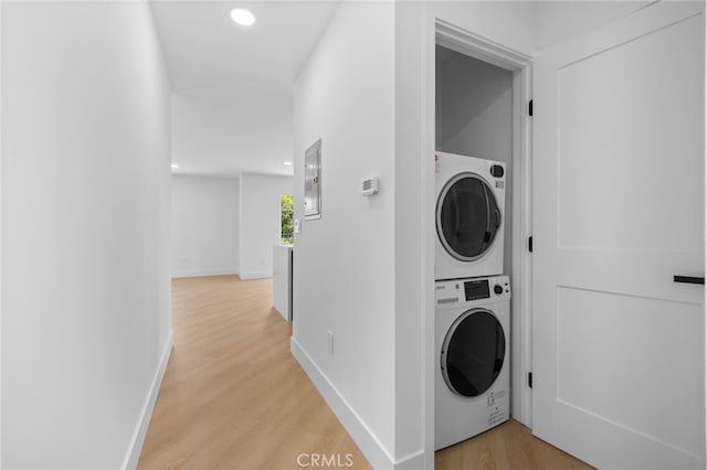 542 N Keystone St, Burbank, CA 91506 - washroom with stacked washer and clothes dryer, light wood-style floors, and recessed lighting