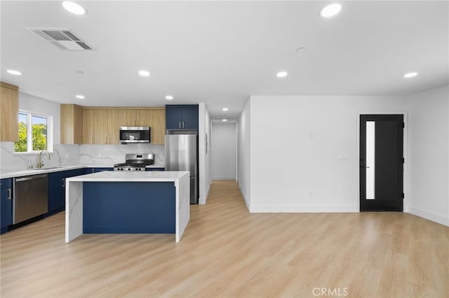 542 N Keystone St, Burbank, CA 91506 - kitchen featuring appliances with stainless steel finishes, a kitchen island, light countertops, recessed lighting, and tasteful backsplash