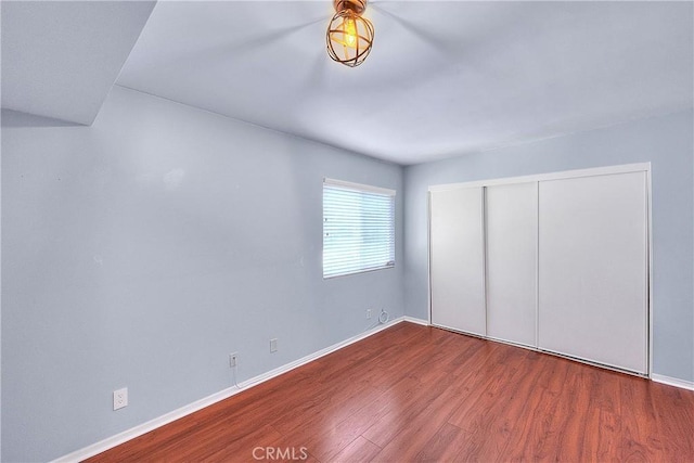11154 Huston St Unit 7, North Hollywood, CA 91601 - unfurnished bedroom featuring wood finished floors and a closet