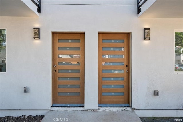 5836 Ernest Ave, Los Angeles, CA 90034 - view of exterior entry featuring stucco siding and a garage