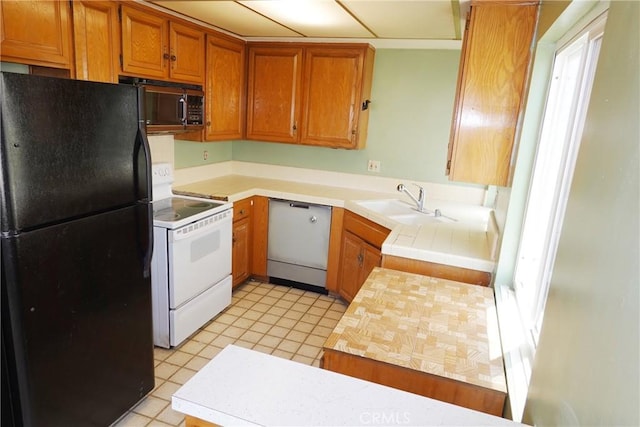 1754 N Kenmore Ave Unit 201, Los Angeles, CA 90027 - kitchen with black appliances and brown cabinets