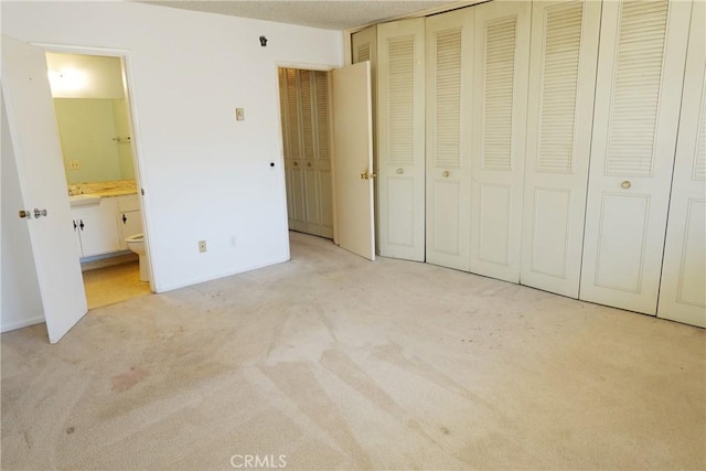 1754 N Kenmore Ave Unit 201, Los Angeles, CA 90027 - unfurnished bedroom with light carpet and connected bathroom