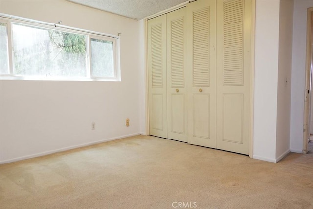 1754 N Kenmore Ave Unit 201, Los Angeles, CA 90027 - unfurnished bedroom featuring light colored carpet and a closet