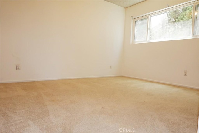 1754 N Kenmore Ave Unit 201, Los Angeles, CA 90027 - empty room featuring light colored carpet and healthy amount of natural light