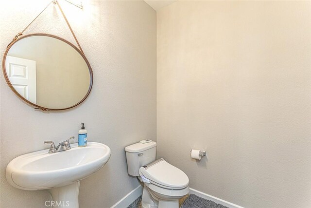 17122 Broken Rock Ct, Riverside, CA 92503 - half bathroom with toilet and baseboards