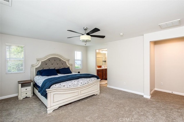 17122 Broken Rock Ct, Riverside, CA 92503 - bedroom featuring multiple windows, carpet, and connected bathroom