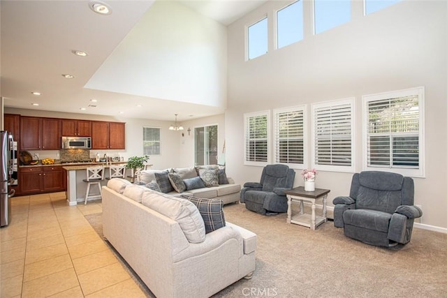 17122 Broken Rock Ct, Riverside, CA 92503 - living room featuring recessed lighting, a high ceiling, and a chandelier