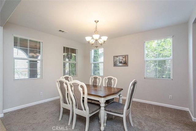 17122 Broken Rock Ct, Riverside, CA 92503 - dining room featuring a chandelier and carpet floors