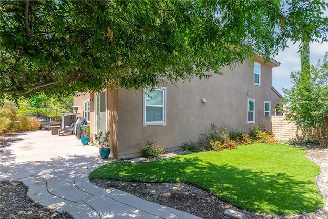 17122 Broken Rock Ct, Riverside, CA 92503 - view of home's exterior with stucco siding and a patio area