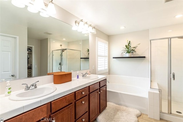 17122 Broken Rock Ct, Riverside, CA 92503 - full bath with a shower stall, a bath, double vanity, tile patterned flooring, and recessed lighting