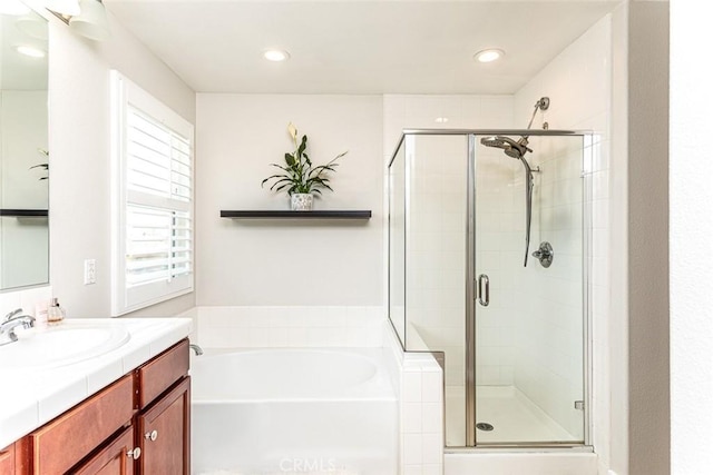 17122 Broken Rock Ct, Riverside, CA 92503 - full bath featuring a bath, vanity, a shower stall, and recessed lighting
