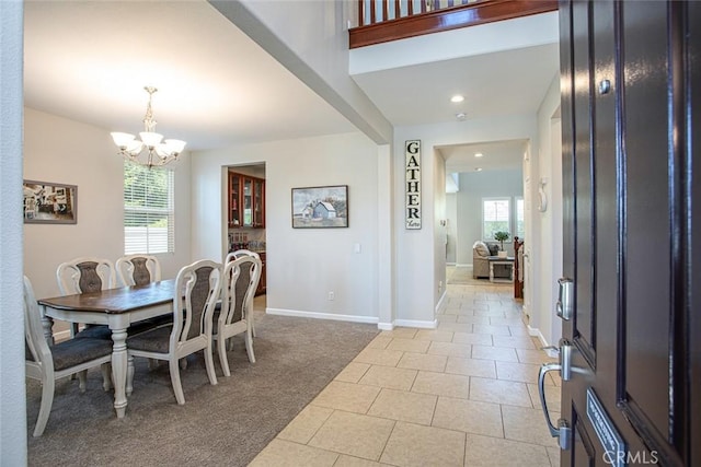 17122 Broken Rock Ct, Riverside, CA 92503 - dining space with a chandelier, light tile patterned floors, recessed lighting, and light colored carpet