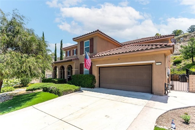 17122 Broken Rock Ct, Riverside, CA 92503 - mediterranean / spanish home featuring concrete driveway, stucco siding, and an attached garage
