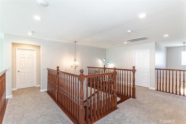 17122 Broken Rock Ct, Riverside, CA 92503 - corridor with an upstairs landing, carpet flooring, recessed lighting, and a chandelier