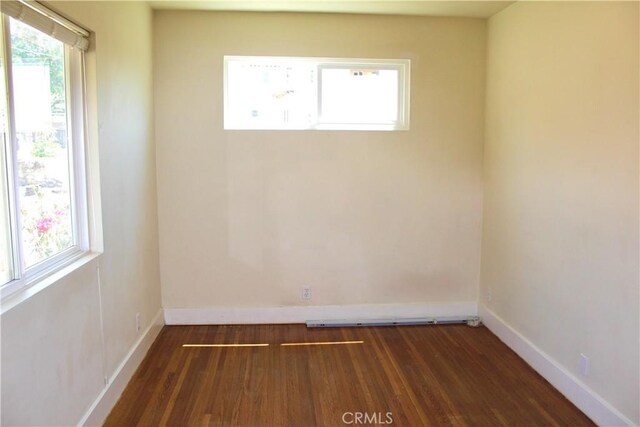 907 E Poppyfields Dr E, Altadena, CA 91001 - unfurnished room with dark wood-style floors and baseboards