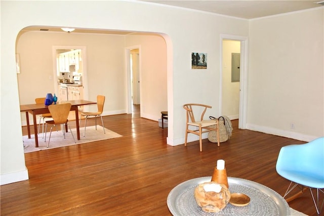 907 E Poppyfields Dr E, Altadena, CA 91001 - living room with arched walkways, wood finished floors, electric panel, and crown molding
