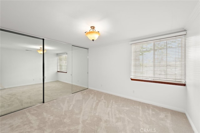 456 Avenida Seville Unit C, Laguna Woods, CA 92637 - unfurnished bedroom featuring carpet floors and a closet