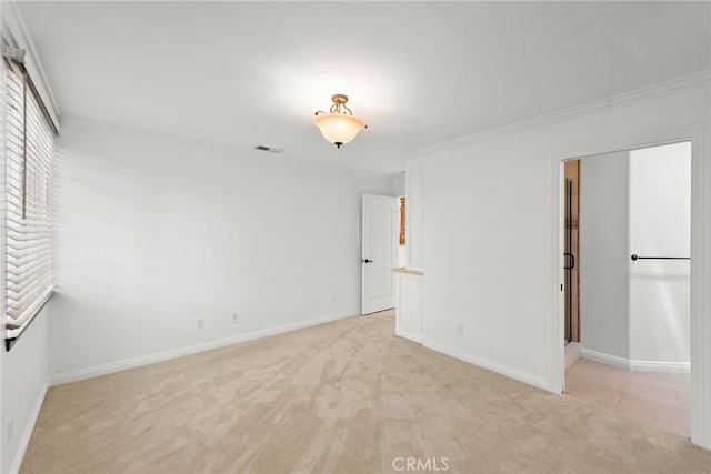 456 Avenida Seville Unit C, Laguna Woods, CA 92637 - unfurnished bedroom with light carpet and ornamental molding