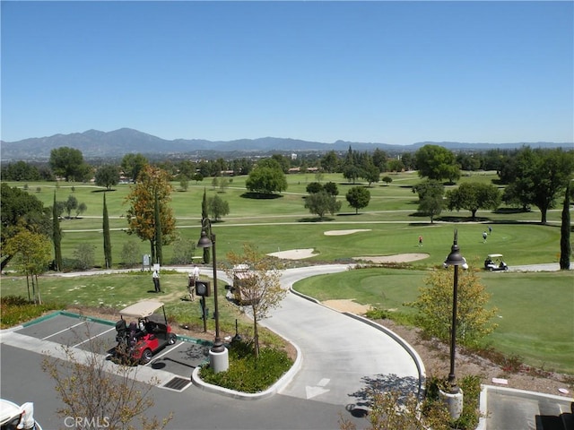 456 Avenida Seville Unit C, Laguna Woods, CA 92637 - surrounding community with a mountain view, golf course view, and a yard