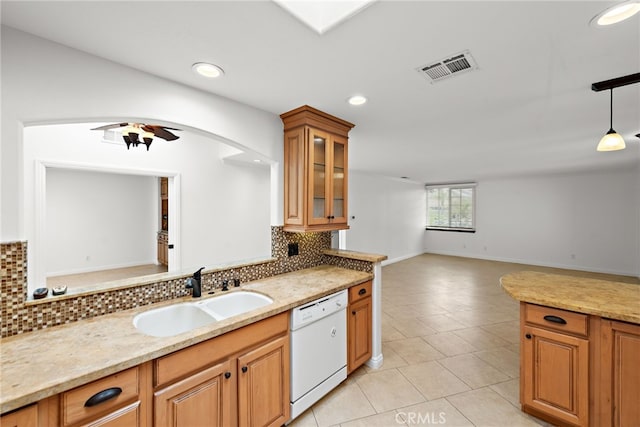 456 Avenida Seville Unit C, Laguna Woods, CA 92637 - kitchen featuring dishwasher, tasteful backsplash, light tile patterned flooring, glass insert cabinets, and recessed lighting