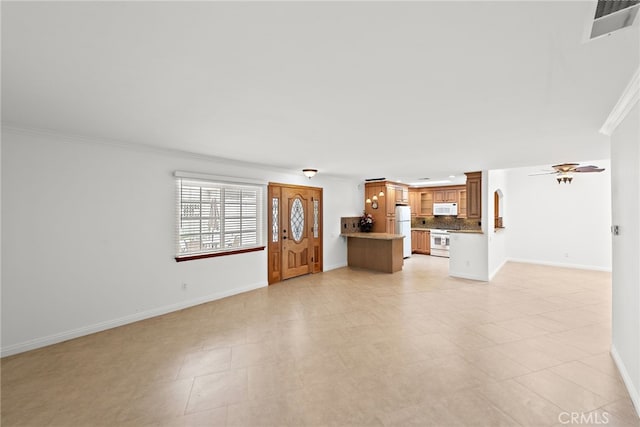 456 Avenida Seville Unit C, Laguna Woods, CA 92637 - unfurnished living room with baseboards and crown molding