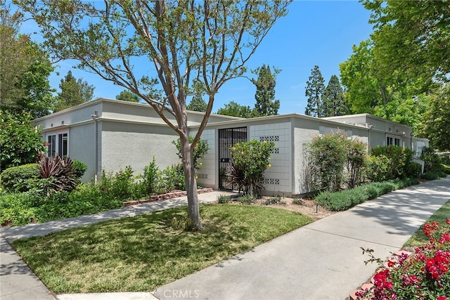 456 Avenida Seville Unit C, Laguna Woods, CA 92637 - mid-century modern home featuring a gate