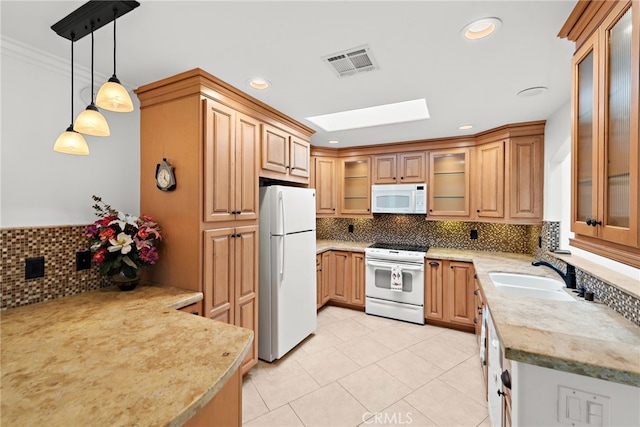 456 Avenida Seville Unit C, Laguna Woods, CA 92637 - kitchen with white appliances, backsplash, light tile patterned floors, pendant lighting, and recessed lighting
