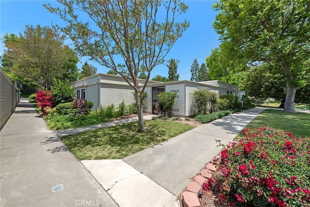 456 Avenida Seville Unit C, Laguna Woods, CA 92637 - view of property's community with a lawn