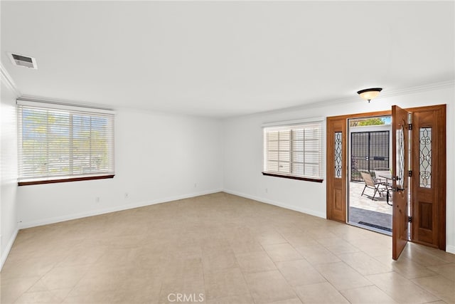 456 Avenida Seville Unit C, Laguna Woods, CA 92637 - empty room featuring crown molding and baseboards