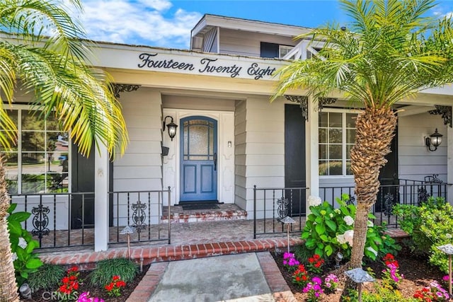 1428 E Adams Ave, Orange, CA 92867 - doorway to property featuring a porch