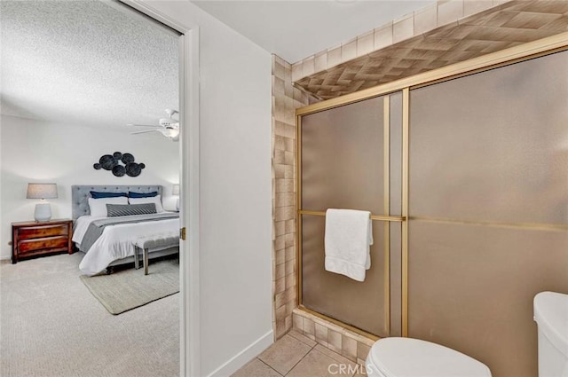 1428 E Adams Ave, Orange, CA 92867 - ensuite bathroom featuring a stall shower, a ceiling fan, and a textured ceiling
