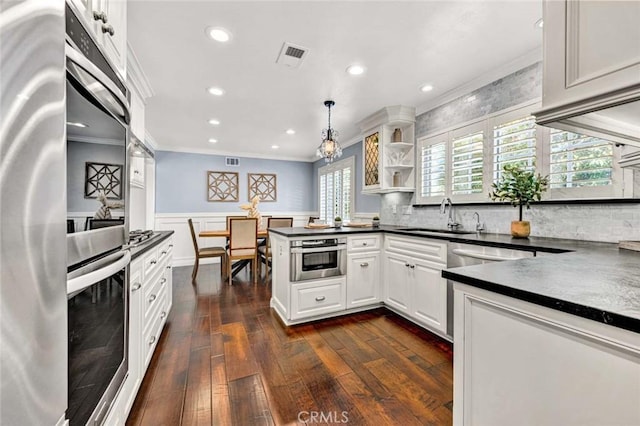 1428 E Adams Ave, Orange, CA 92867 - kitchen with ornamental molding, a peninsula, dark countertops, fridge, and open shelves