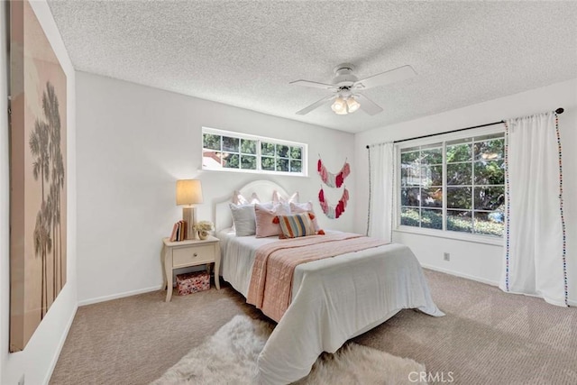 1428 E Adams Ave, Orange, CA 92867 - bedroom featuring carpet, a textured ceiling, and ceiling fan